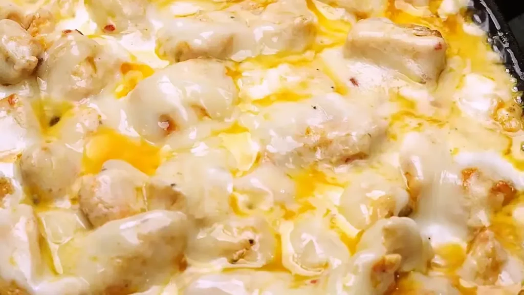 Delicious Cheesy Sizzling White Sauce Garlic Chicken ready to serve